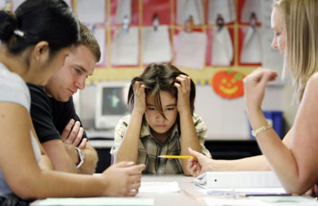 Parents helping kids with homework