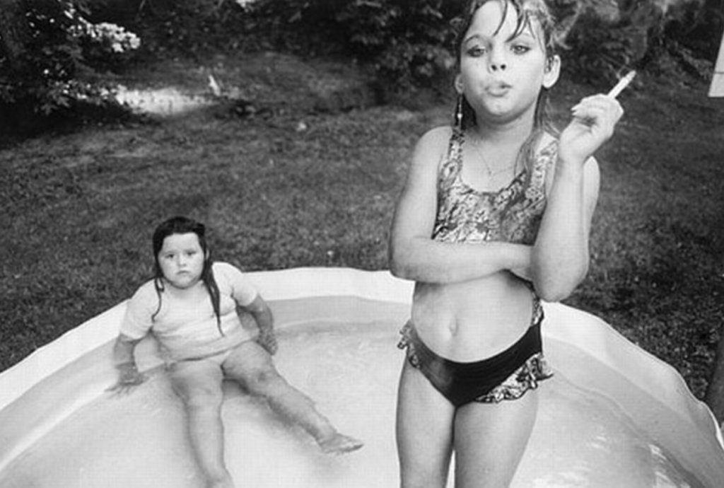 Little girl smoking a cigarette