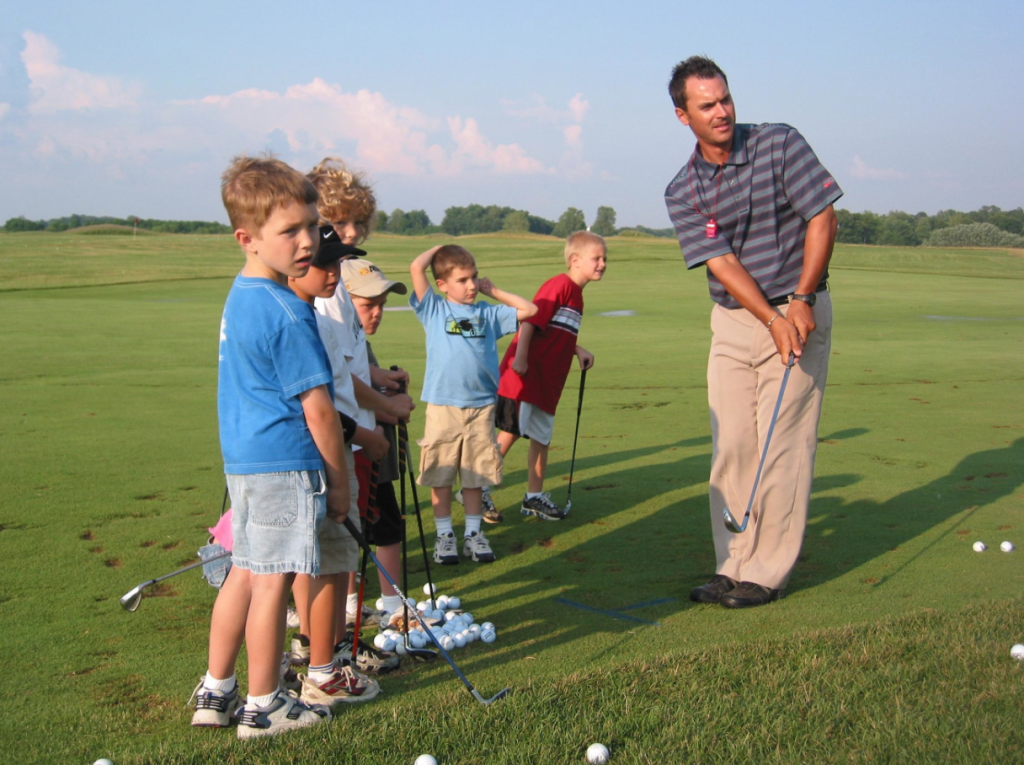 Parents and kids golfing