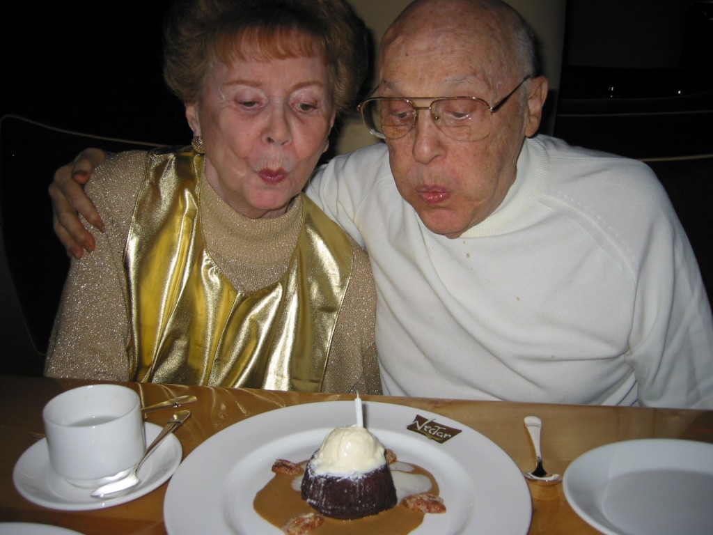 Mom and Dad blowing out candle in Nectar